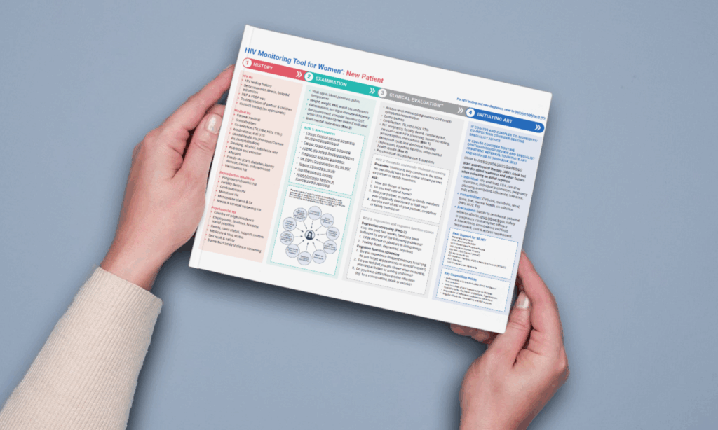 Hands holding the print out of the HIV Monitoring Tool for Women